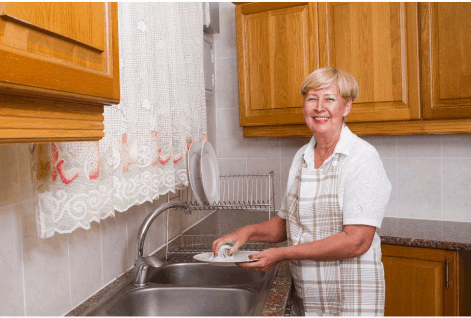 woman washing dishes independence in your home older adults Buffalo Occupational Therapy Experts in Rehab Neurological Rehabilitation - Buffalo Occupational Therapy